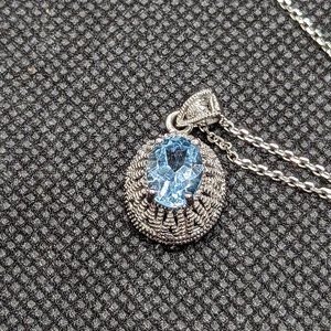 Interestingly set sky blue topaz in .925 sterling